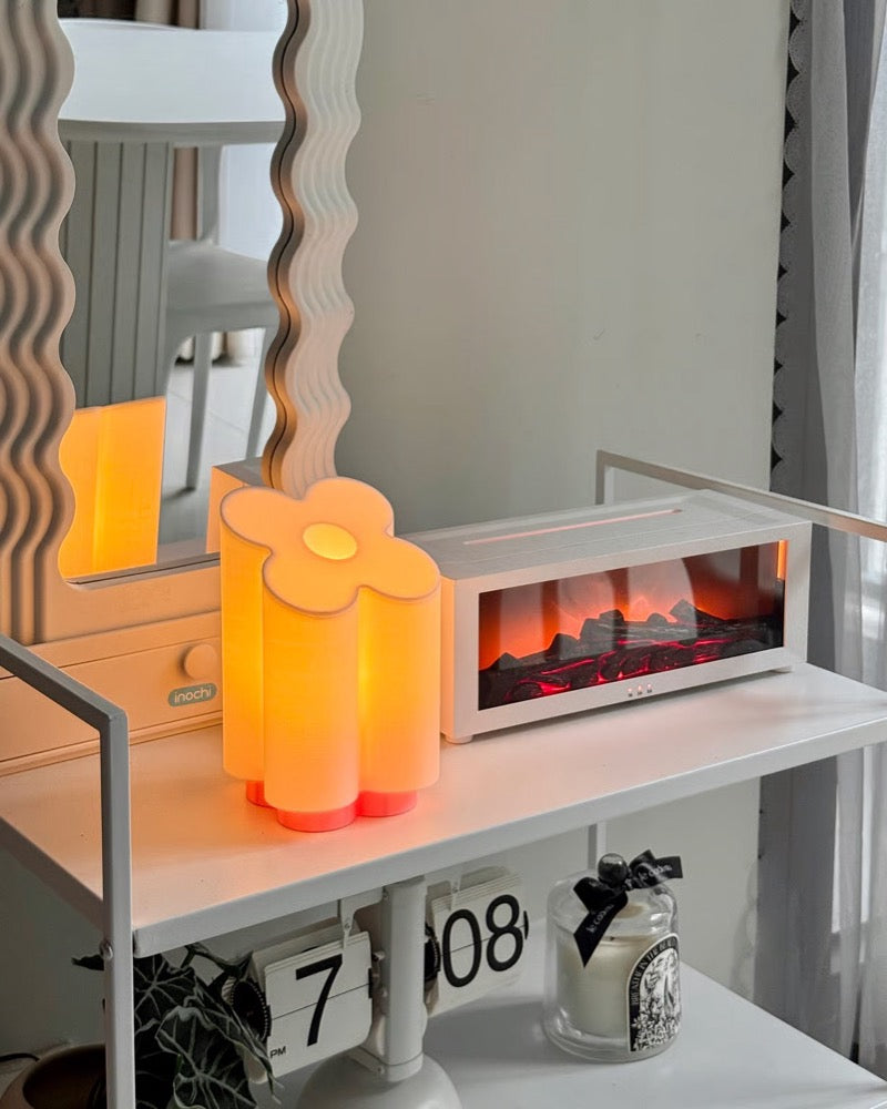 Candles arranged on a shelf in a styled interior